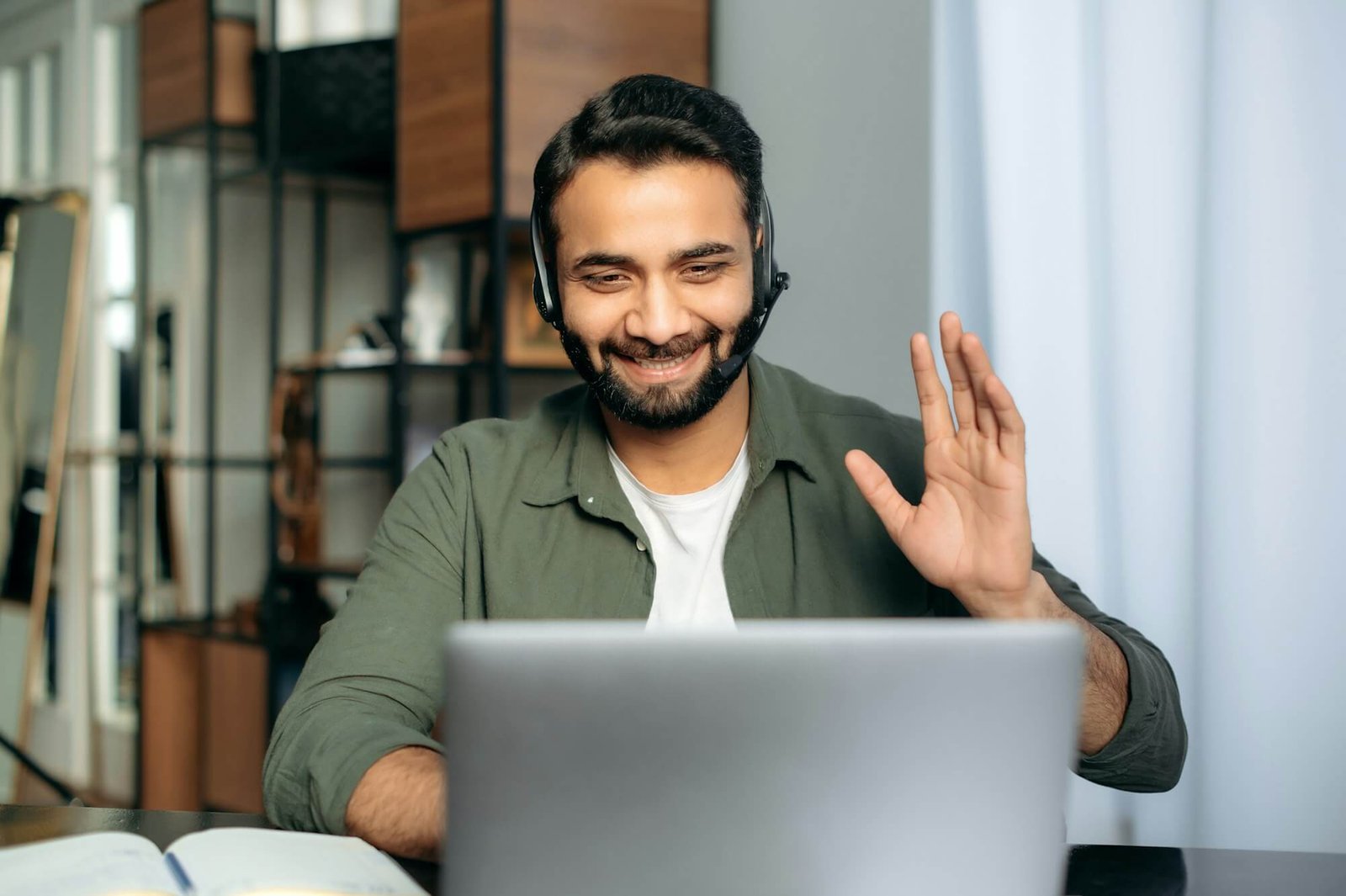 positive-attractive-indian-guy-in-headphones-hotline-operator-support-worker-online-consultant.jpg